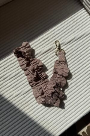 Collier téléphone brun à pois